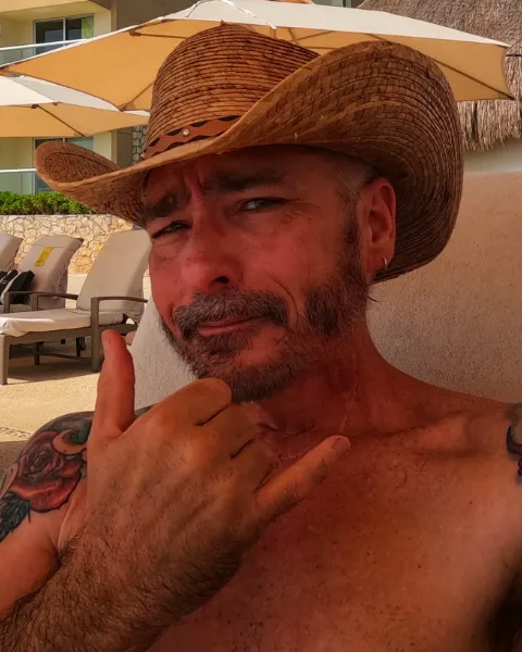 Ron Sparks in a straw cowboy hat